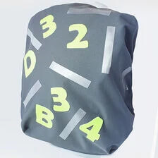 X-Sybeskrivning för regnskydd till skolryggsäck